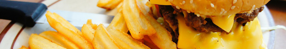 Eating Burger Sandwich Cheesesteak at Philly Cheesesteak Place restaurant in Atlanta, GA.
